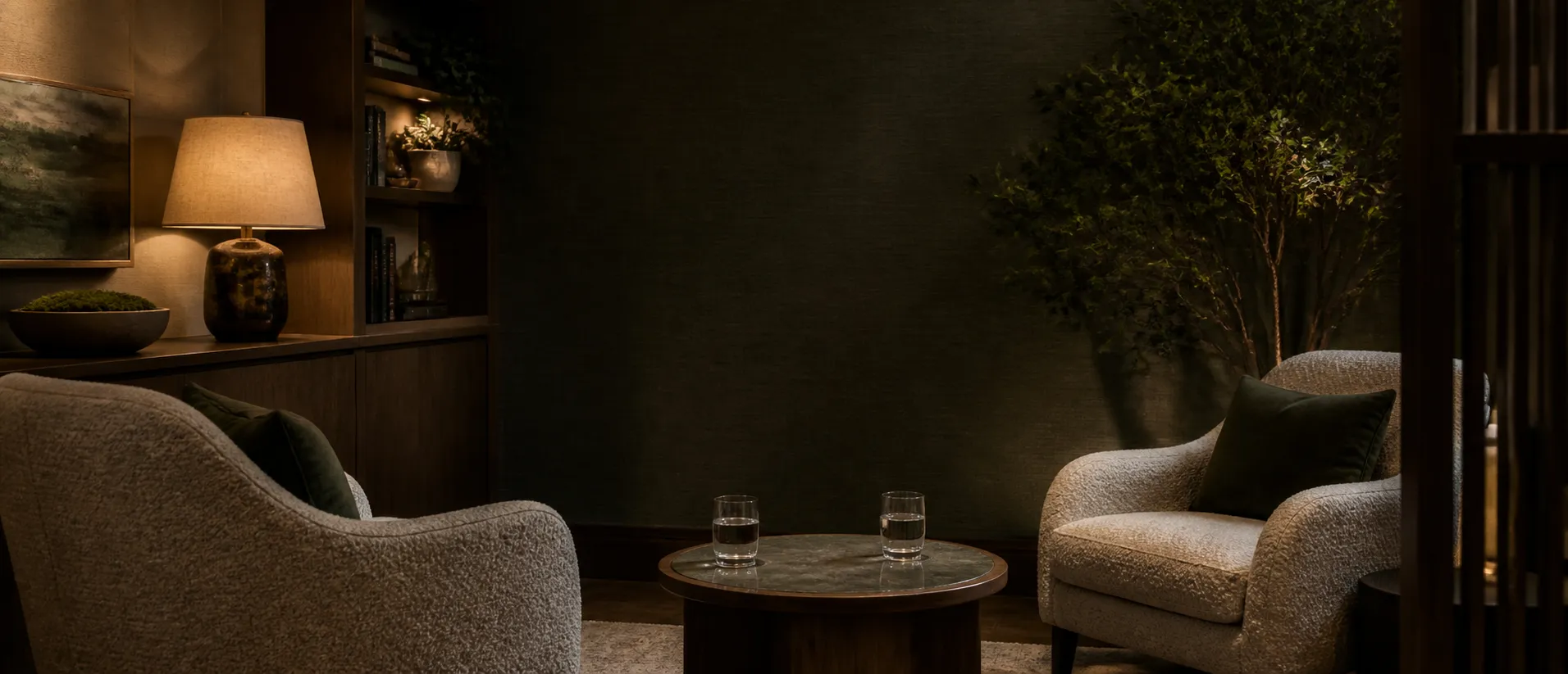 Two armchairs prepared for a private consultation in a quiet evening room