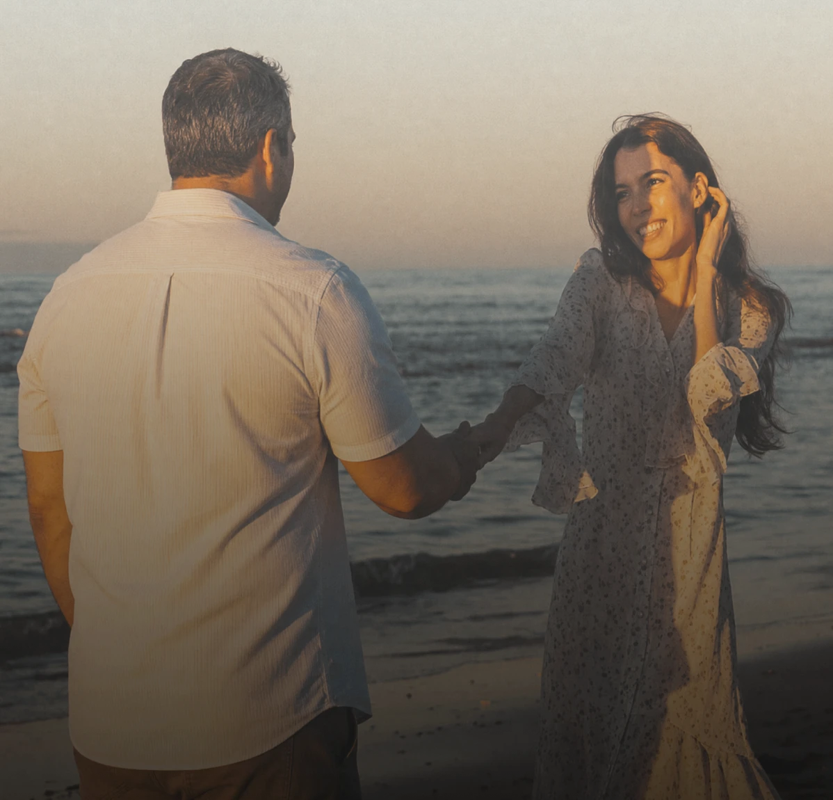 A couple walking together by the sea