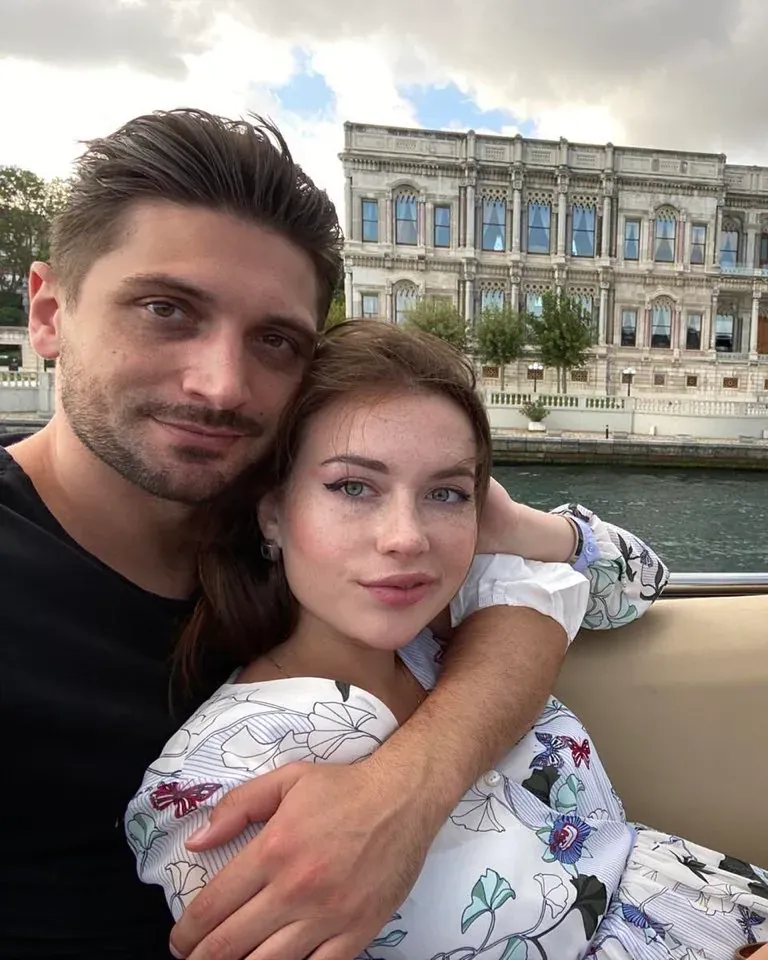 Garrett and Veronika together in front of a grand building.